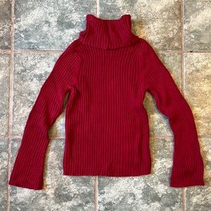 Maroon turtleneck sweater with bell sleeves